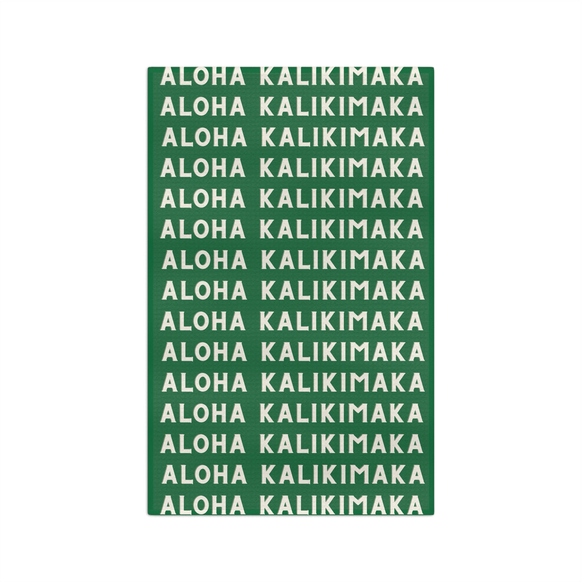 Green Aloha Kalikimaka holiday kitchen towel with repeating cream lettering