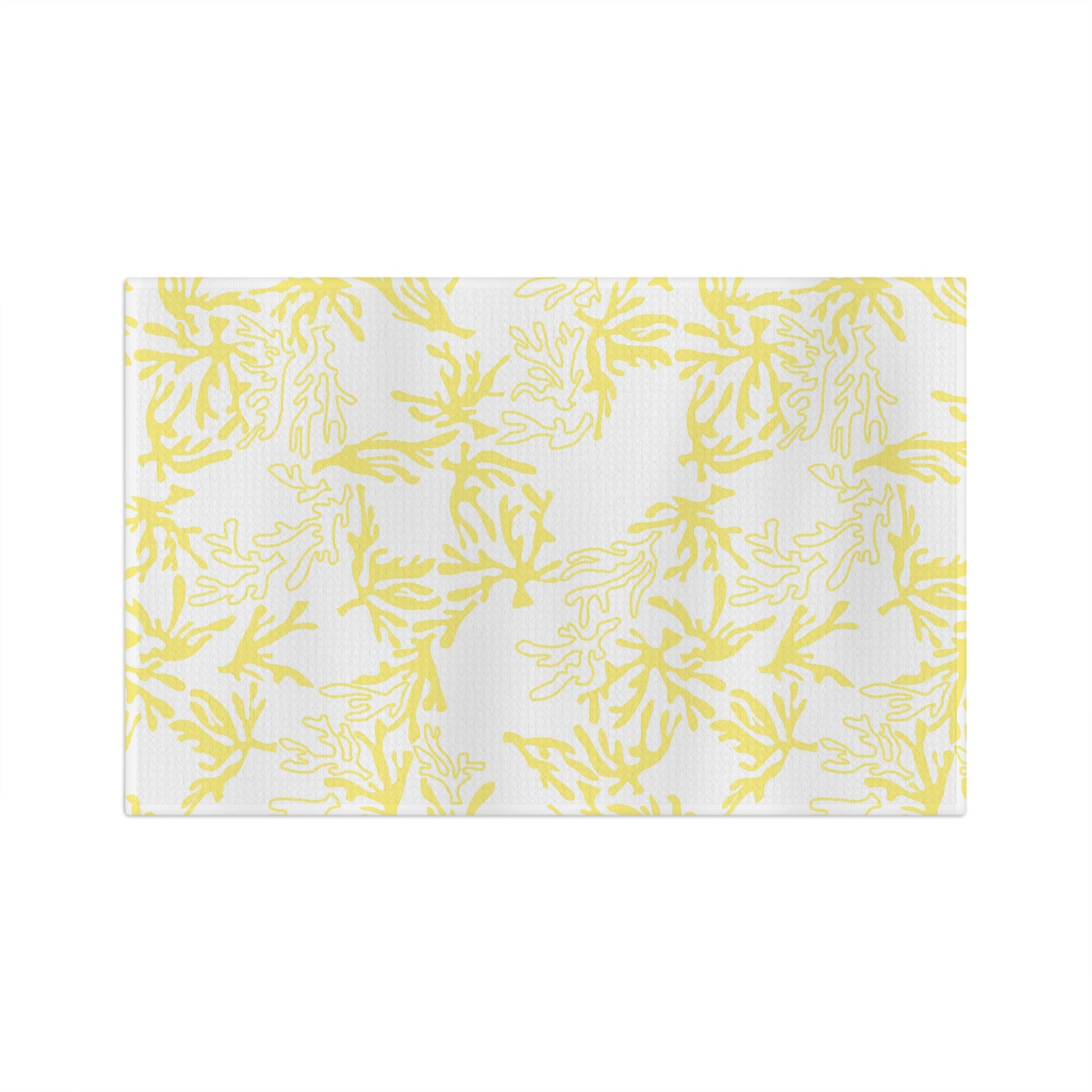 Microfiber kitchen towel featuring the original Global Village Kailua Coral Sunshine pattern in soft yellow and white, adding a bright island-inspired touch to any kitchen.