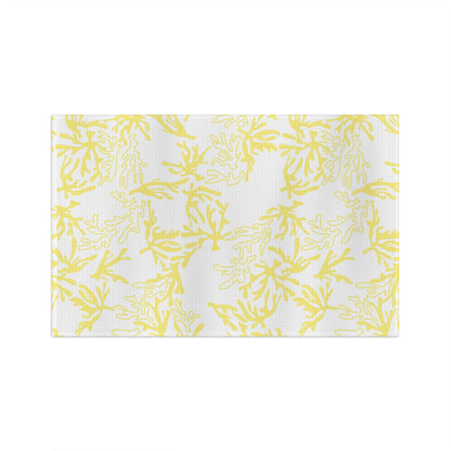 Microfiber kitchen towel featuring the original Global Village Kailua Coral Sunshine pattern in soft yellow and white, adding a bright island-inspired touch to any kitchen.