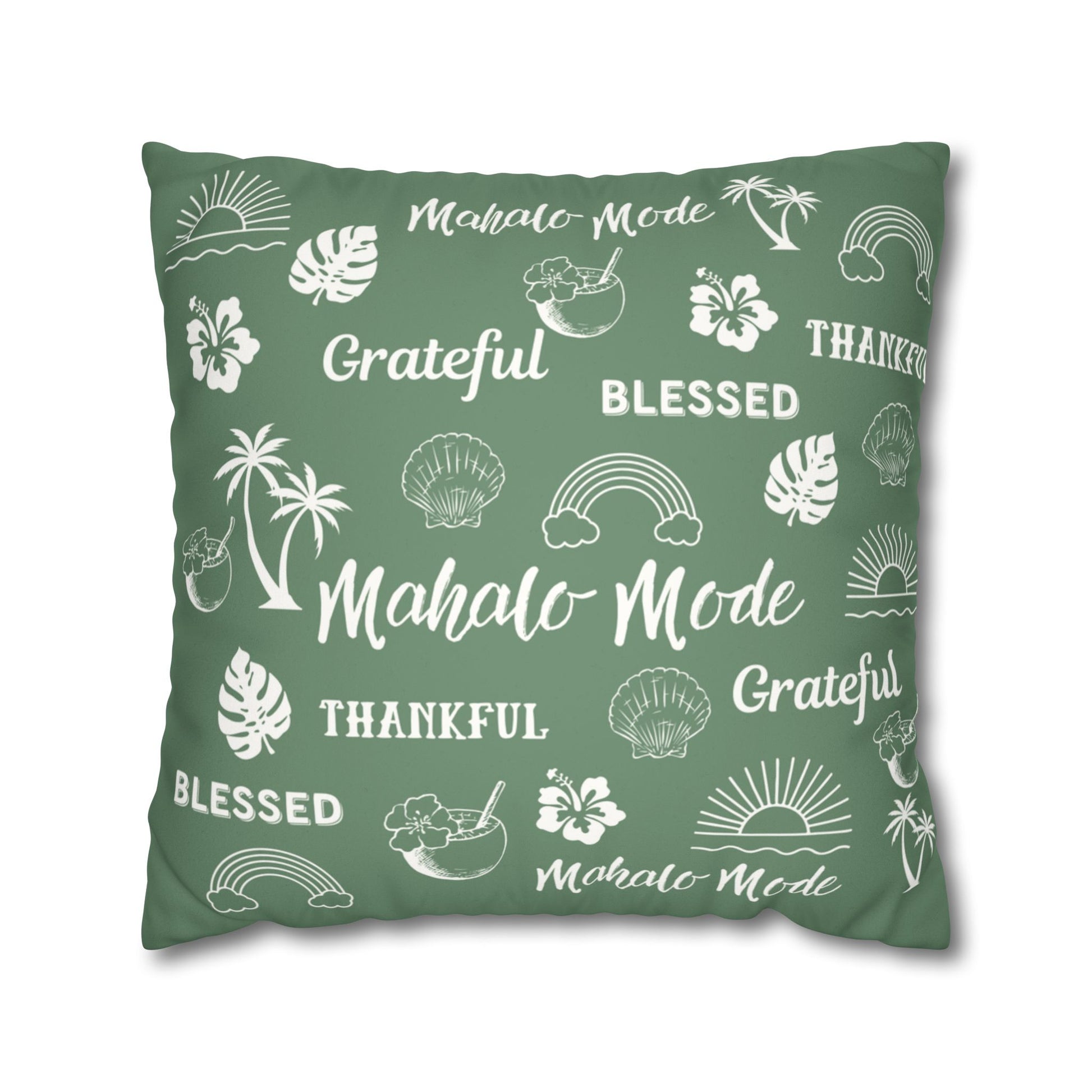 A square sage green throw pillow featuring a white tropical-themed print with words like 'Mahalo Mode', 'Grateful', and 'Blessed' alongside palm trees, hibiscus flowers, seashells, rainbows, and sunsets, shown on a plain white background.