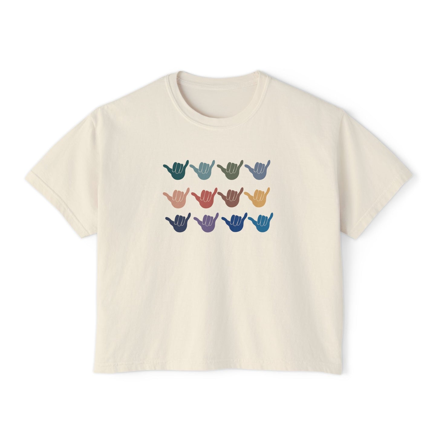 An off-white crop short-sleeve t-shirt with a graphic of twelve shaka signs in various colors arranged in three rows, displayed on a clean white background.