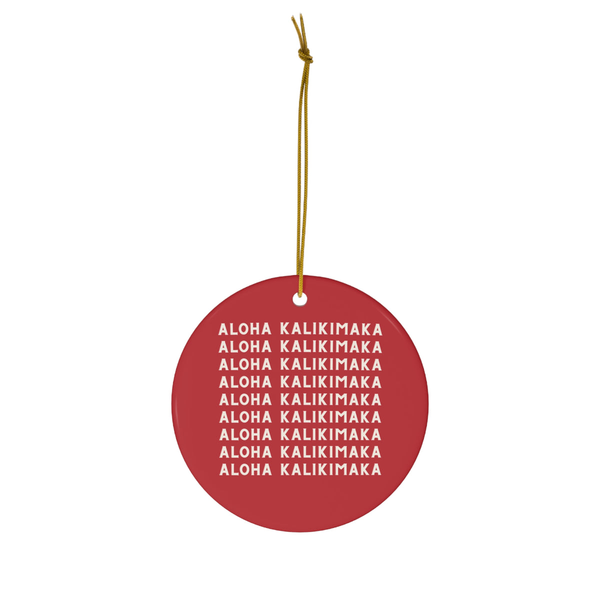 Red ceramic Christmas ornament featuring repeating cream Aloha Kalikimaka lettering on both sides.