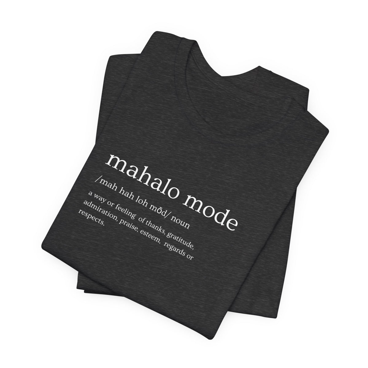 A folded dark charcoal gray heather t-shirt with a white printed dictionary-style definition of 'mahalo mode' on the chest, shown against a plain white background.