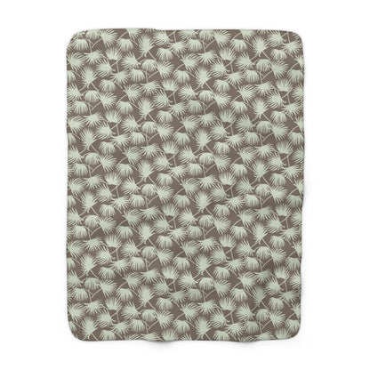 Fan Palm Mocha Mint sherpa fleece blanket with a repeating mint palm leaf pattern on a warm mocha background.