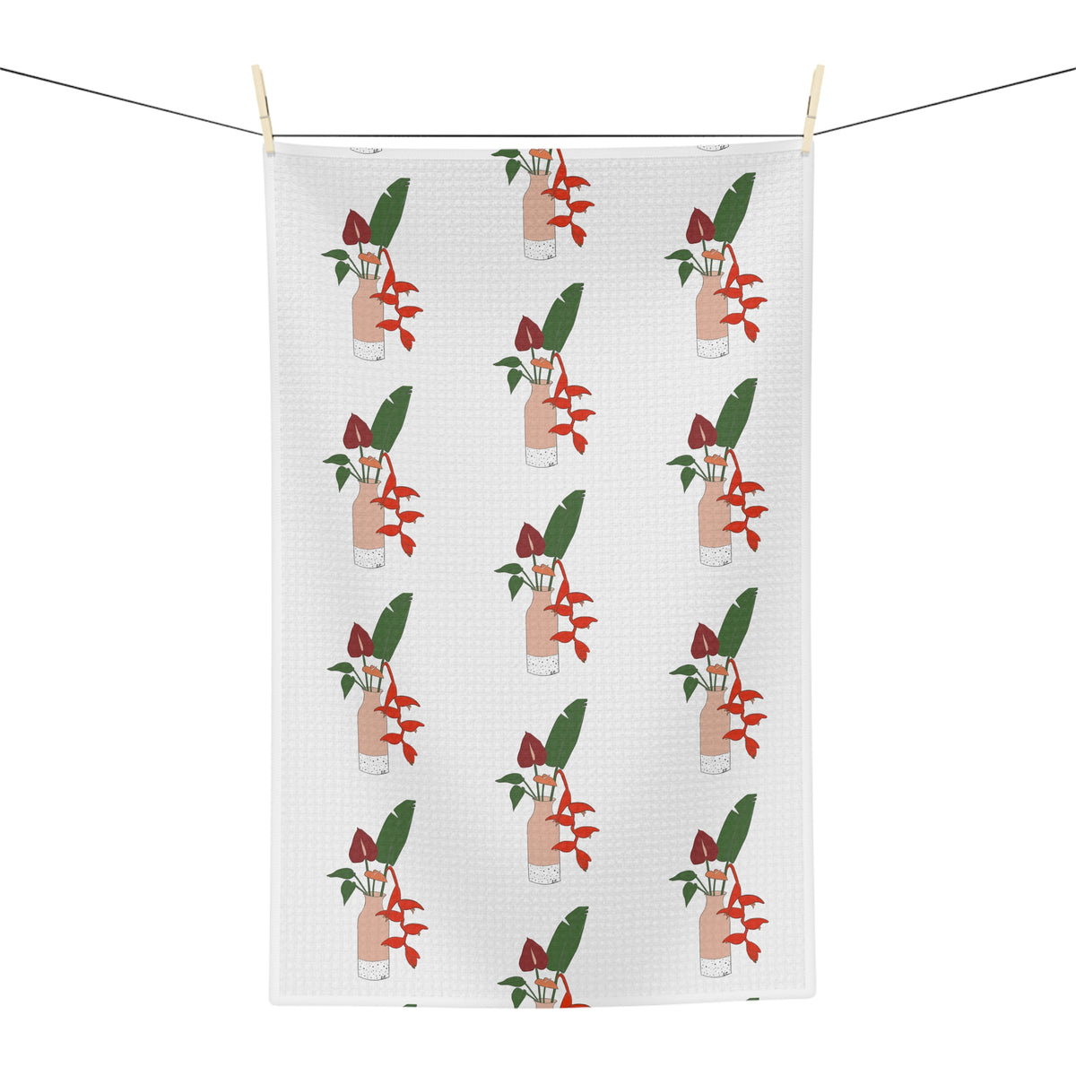 Anthurium Bouquet Hawaiʻi kitchen towel with red anthuriums and tropical green leaves on a neutral background