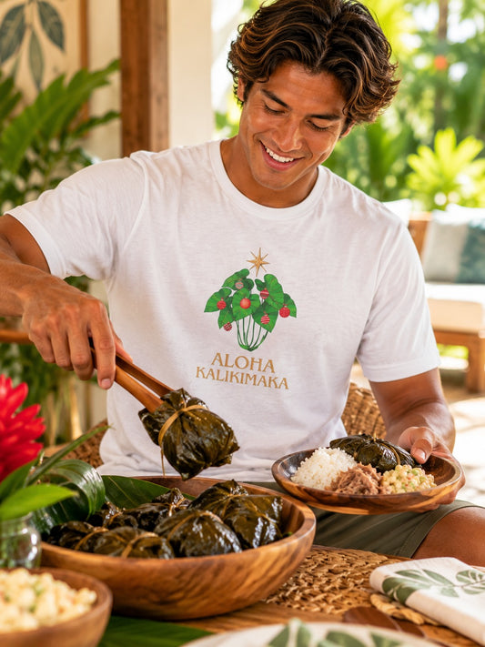 Man wearing a white Aloha Kalikimaka graphic tee serving lau lau at a tropical holiday gathering.