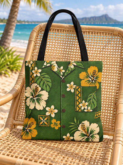 Green tote on rattan chair: Green vintage aloha shirt tote with cream and mustard hibiscus flowers displayed on a light rattan chair beside the beach.