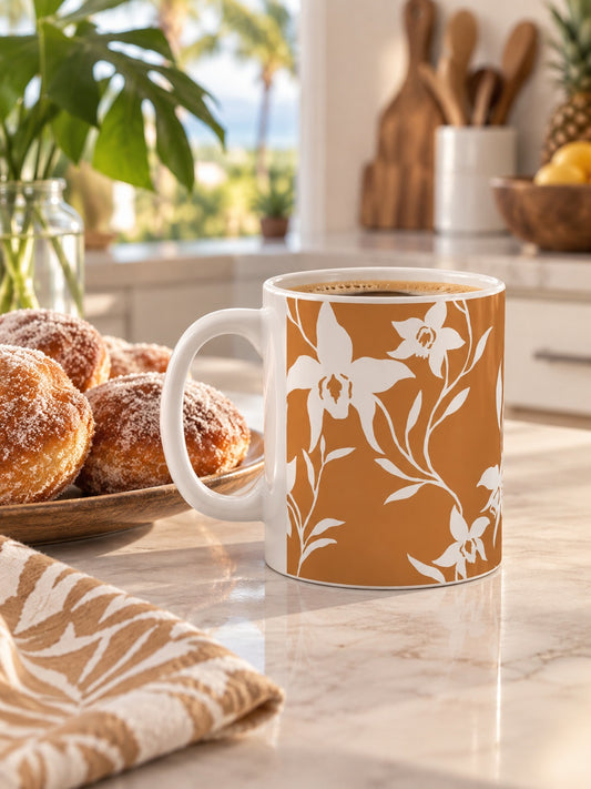 Orchid Caramel ceramic coffee mug beside a plate of malasadas on a bright tropical kitchen island.