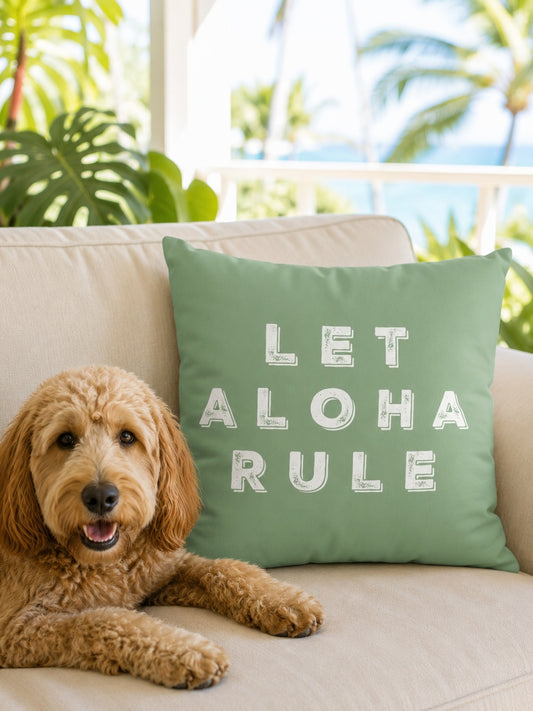 let aloha rule sage pillow on beige couch with dog laying next to it